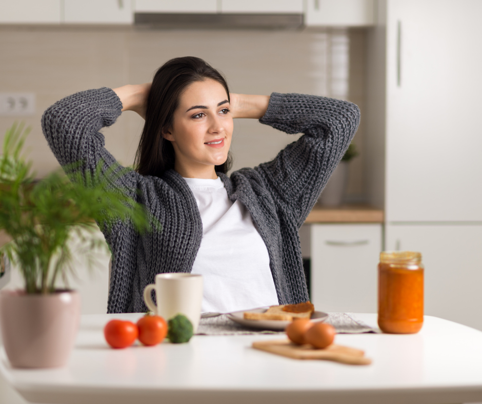 woman sitting at table intuitive eating