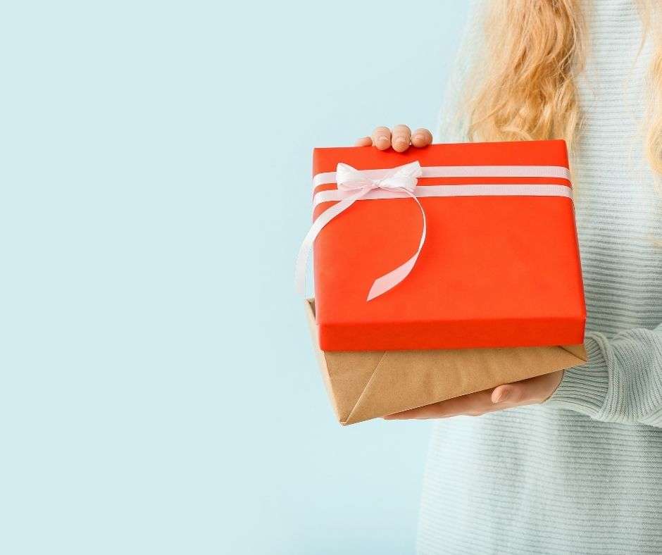 woman holding 2 gifts